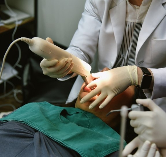 Dentist capturing intraoral cameras of a patients mouth