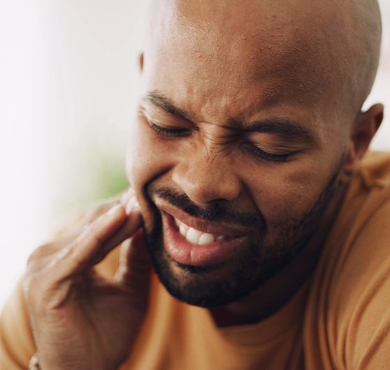 Closeup of patient experiencing toothache
