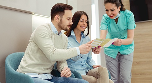 Patients consulting a dentist about dental insurance