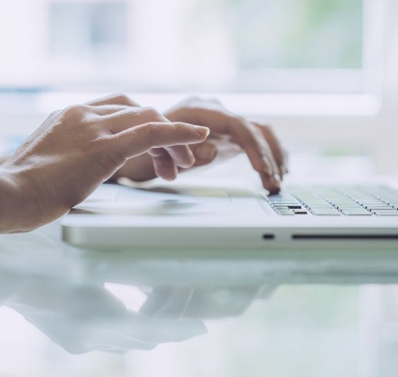 Person typing on a laptop