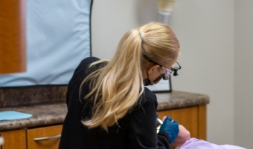 Dental professional treating a patient