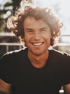 a man smiling with healthy teeth