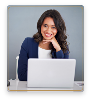 Woman in business attire smiling at her laptop