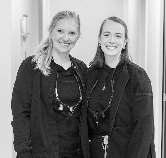 Two smiling dental team members in Raleigh dental office