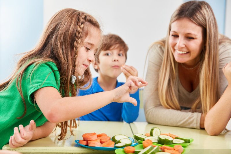 children eating vegetables for a snack