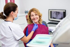 Older woman at dental implant consultation