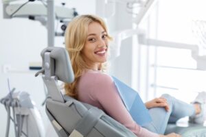Woman smiling after her tooth extraction